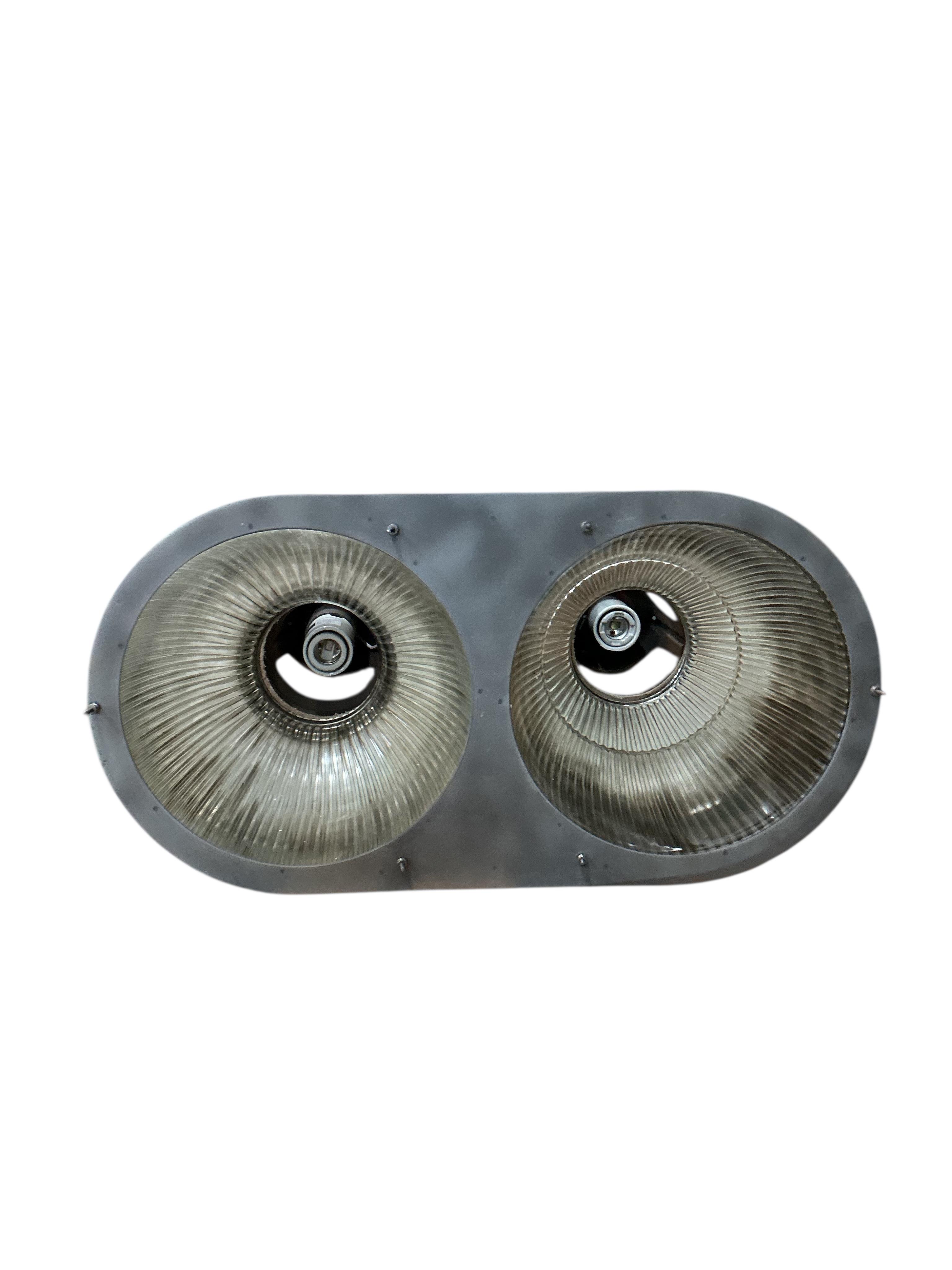 A pair of Holophane double industrial factory lights, width 64cm, height 42cm